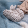 Super soft wool blend knit baby booties with super cute bunny ears on top.