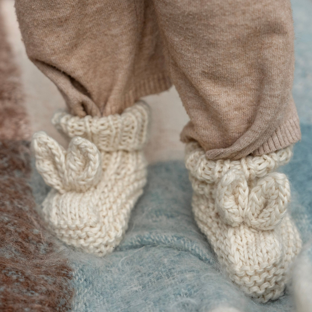 Super soft wool blend knit baby booties with super cute bunny ears on top.