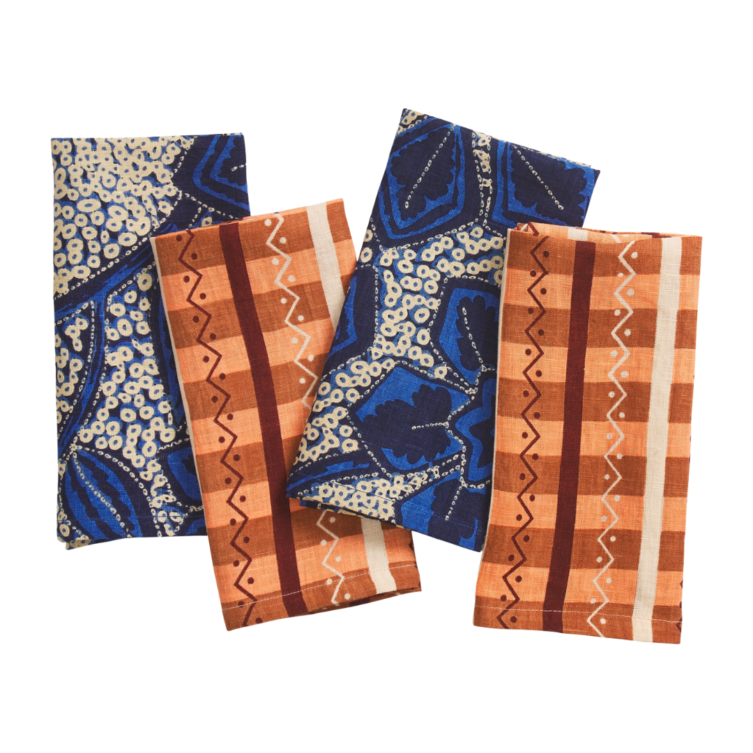 The geometric design of Rikita is inspired by traditional weaving techniques. Find spice shades contrasted against the moody blue-hues of the Kavi design from Sage & Clare