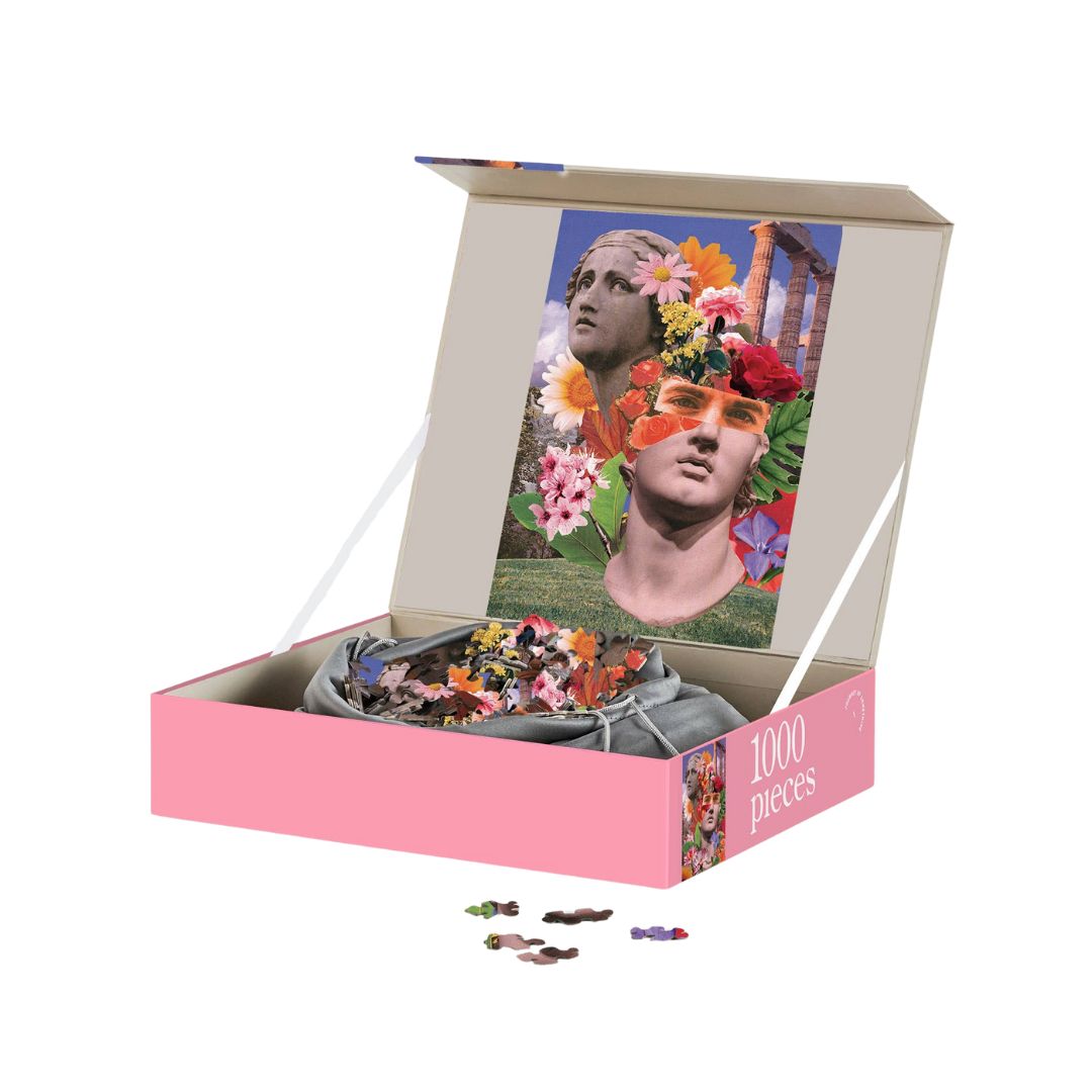 Jigsaw puzzle with a decorative box featuring a woman with flowers in her hair on a white background