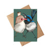 Greeting card with bird illustration on a green background, placed on a brown envelope.