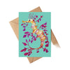 Greeting card with a colorful seahorse design on a teal background, accompanied by a brown envelope.