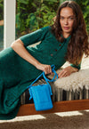 Streamlined and super practical shape, designed to keep you hands free. Fits large smart phones with room for your extras. Designed in smooth veg tanned leather, featuring a top zip and either knotted or beaded and tassel details.  Perfect for travelling light and we just LOVE this fun bright blue! Nancybird