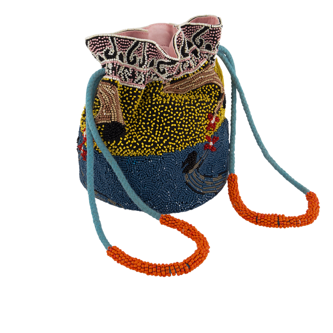 An exceptional hand beaded pouch, using thousands of glass beads to create this sparkling pouch shape, with drawstring closure finished with beading on the wrist straps. Featuring the beautiful artworks of Lucy Anderson .  Hand beaded pouch shape with a drawstring closure. Cotton lined. Nancybird