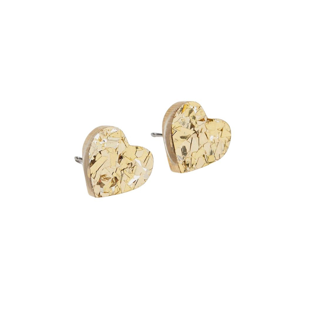 Heart-shaped gold confetti earrings on a white background