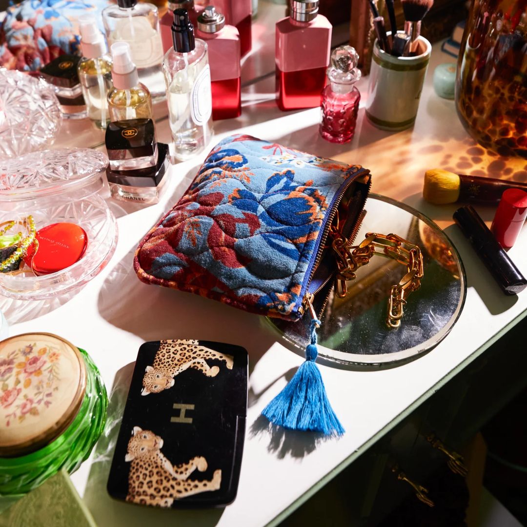 Add a level of luxury to your handbag with this velvet pouch featuring Margot print