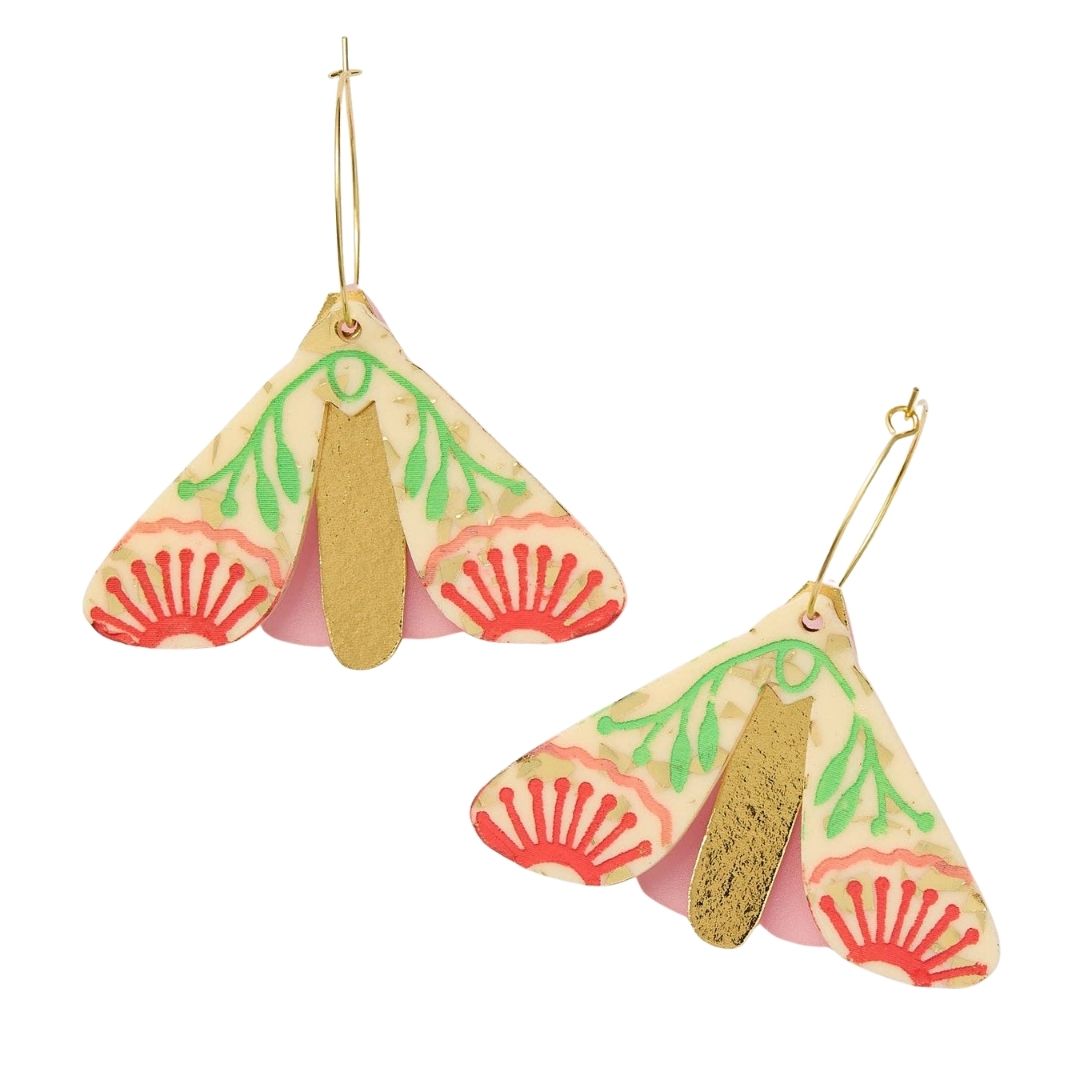 Pair of moth-shaped earrings with pink, green, and gold design on a white background