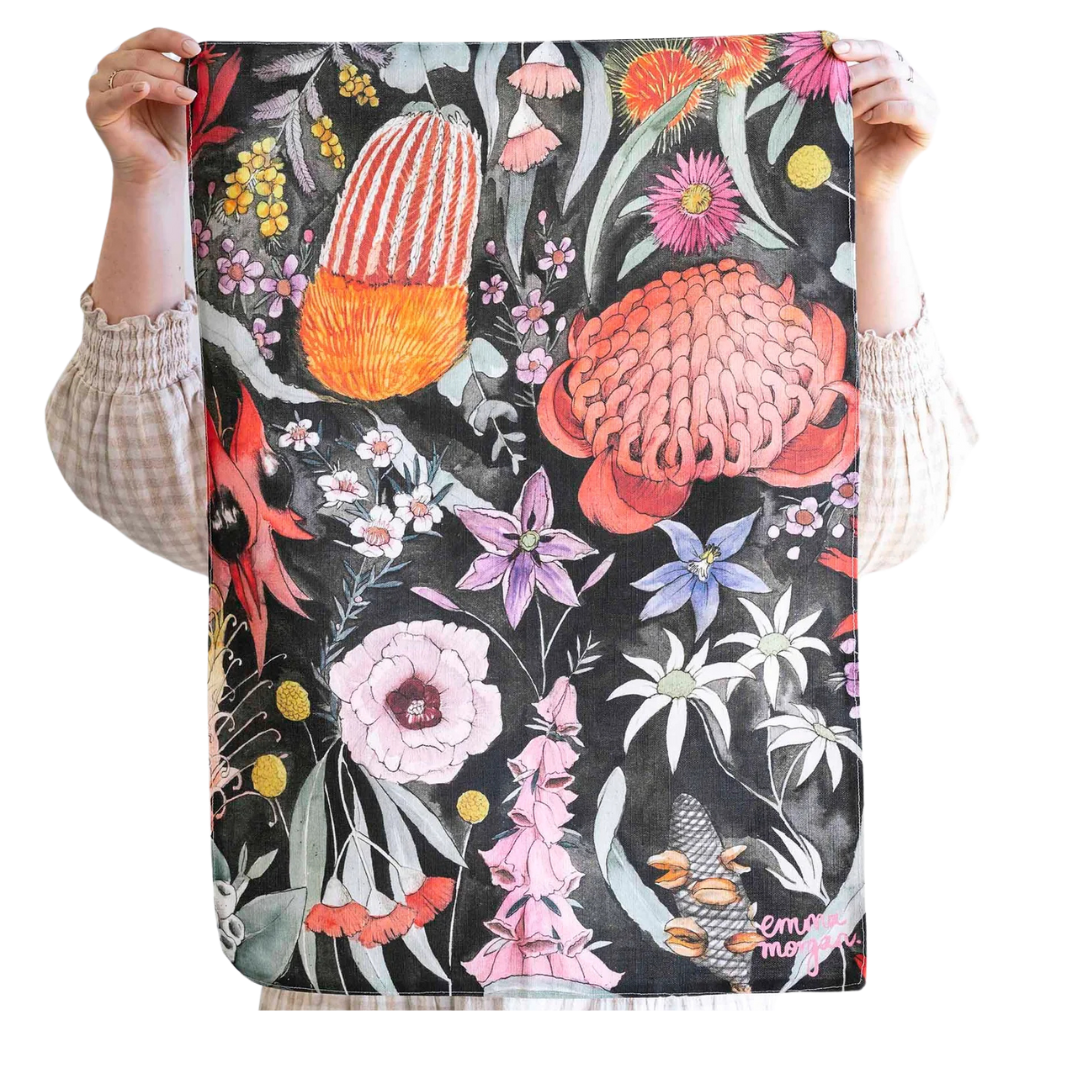 Beautiful "motherland" teat towel with a dark background to really make the flowers pop! By Emma Morgan