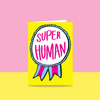 A winning ribbon saying super huamn!