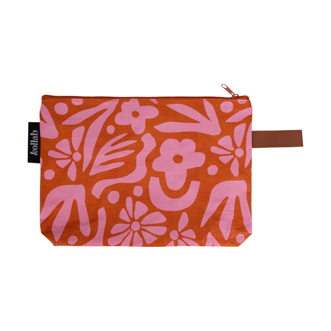 The clutch is fantastic addition, great for toiletries, wet swimmers or even as a purse! Designed by Kollab