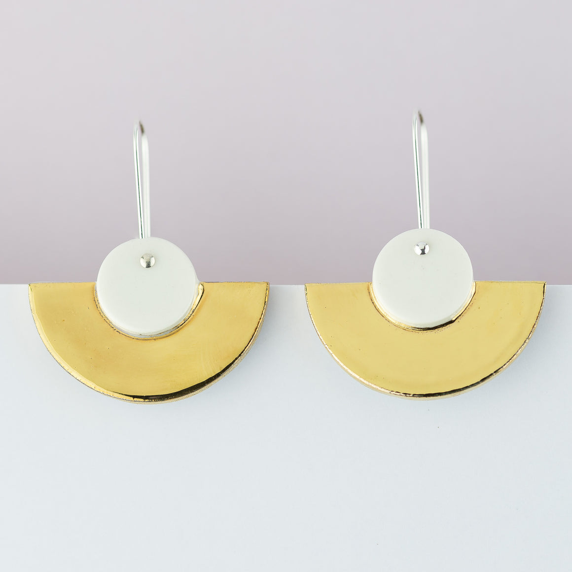 erin lightfoot-We love these Crescent earrings. Inspired by Art Deco Style, the Crescents are classic and elegant with their strong, gold highlight.  Created from green porcelain, painted with contrasting gold lustre and finished on sterling silver hooks.