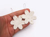 togetherness design-The Flowerburst earrings feature lightweight hand built ceramic pieces suspended on 35mm surgical steel hooks and coloured with our white glaze. As every pendant has been made by hand they are each unique and may differ slightly from pictures. 