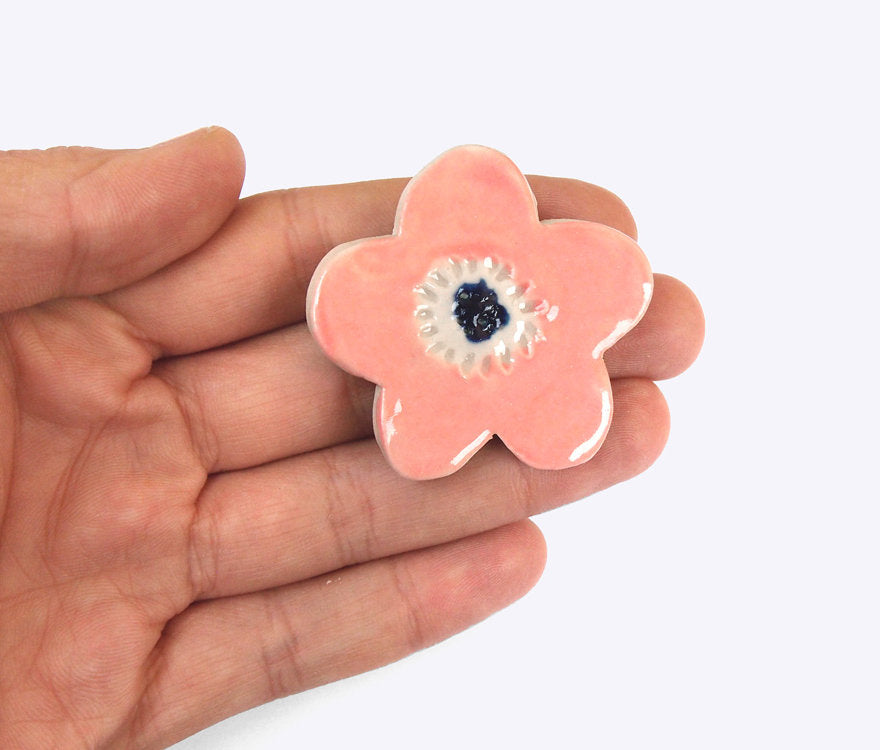 Togetherness design-The Pink Blossom brooch features a hand built ceramic piece that will add a playful touch to your outfit. Features a silver metal clasp on the reverse.