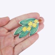 Togetherness design -The wattle brooch features a hand built ceramic piece that will add a playful touch to your outfit. Features a silver metal clasp on the reverse.